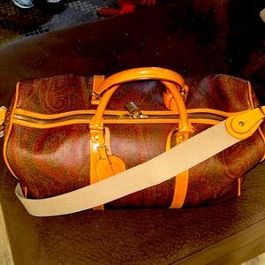 Etro travel bag with lock and key and name tag